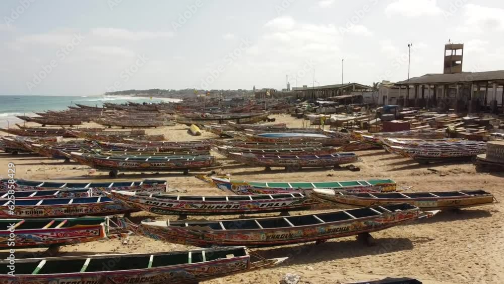 Kayar View The camera glides over sprawling formation of colorful wooden fishing ...