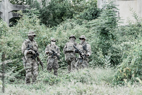 United States Army ranger during the military operation. Professional marine soldiers training with weapon on a military range.