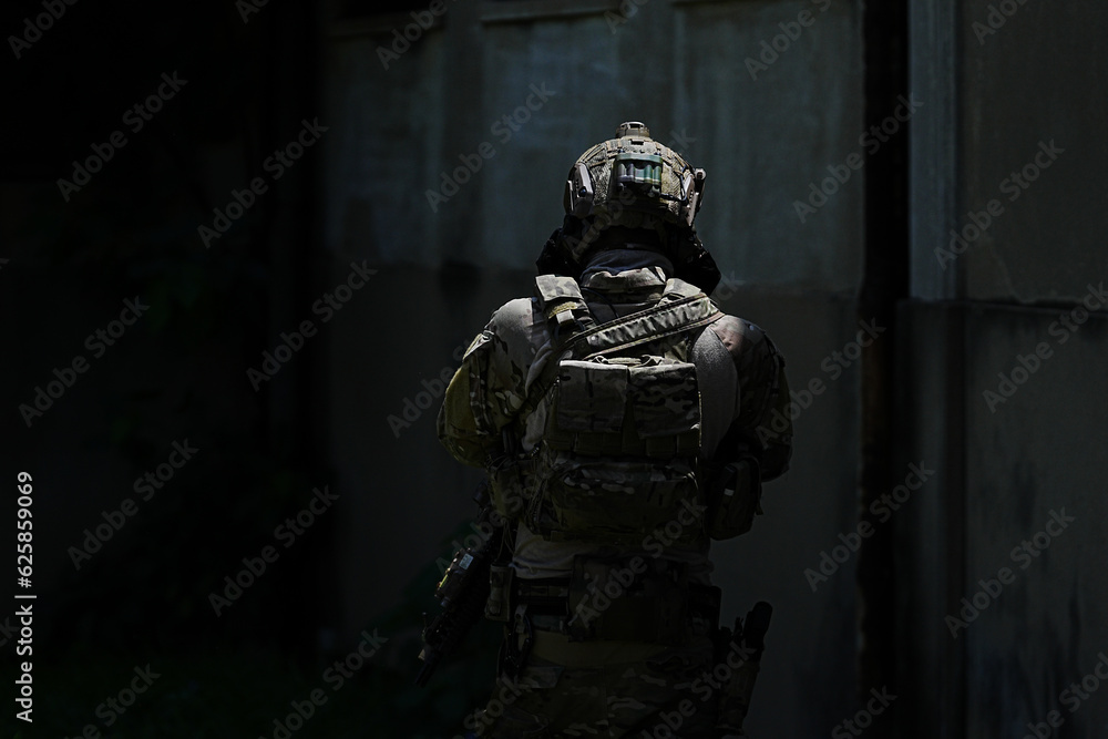 United States Army ranger during the military operation. Professional marine soldiers training with weapon on a military range. United States Army ranger during the military operation. Professional marine soldiers training with weapon on a military range.