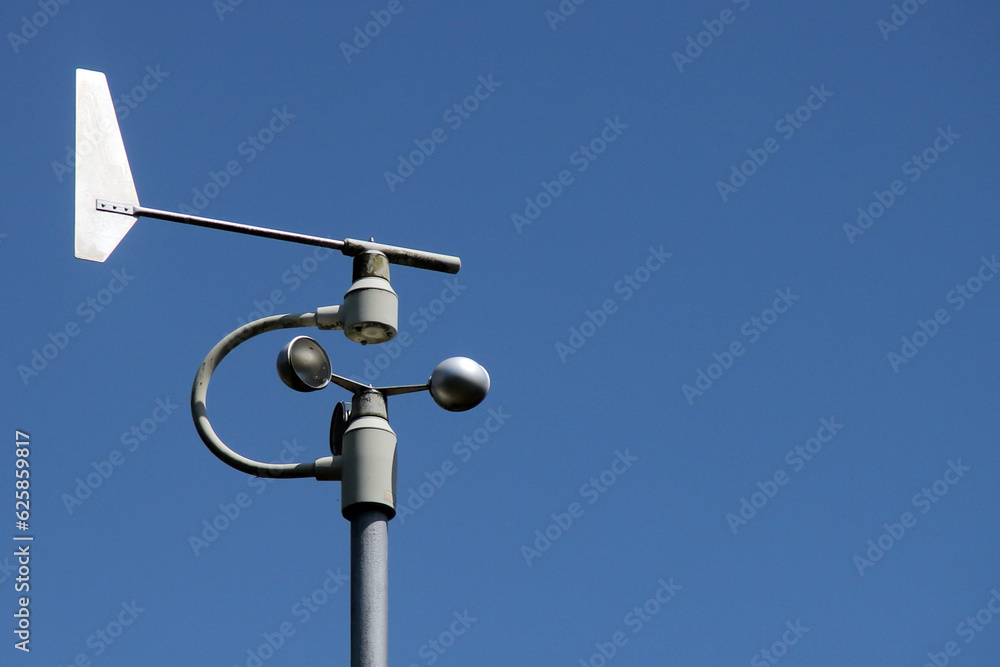 Weather station instruments against blue sky background Weather station instruments against blue sky background