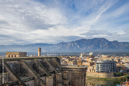 Landscape of the city of Tortosa with the top of the cathedral and mountains, from above photo