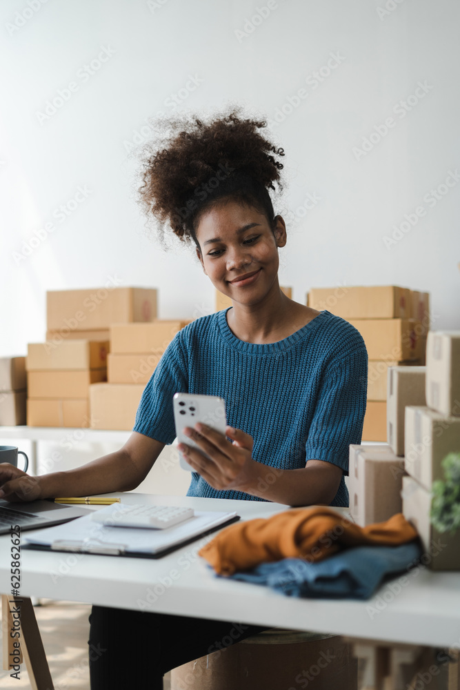 Woman holding smart phones. Entrepreneur working at home. Online shopping, e-commerce, internet banking, spending money, working from home concept. Woman holding smart phones. Entrepreneur working at home. Online shopping, e-commerce, internet banking, spending money, working from home concept.