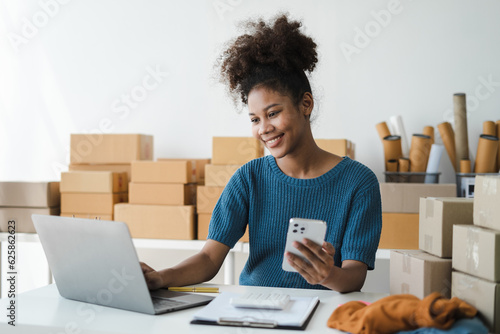 Woman holding smart phones. Entrepreneur working at home. Online shopping, e-commerce, internet banking, spending money, working from home concept.