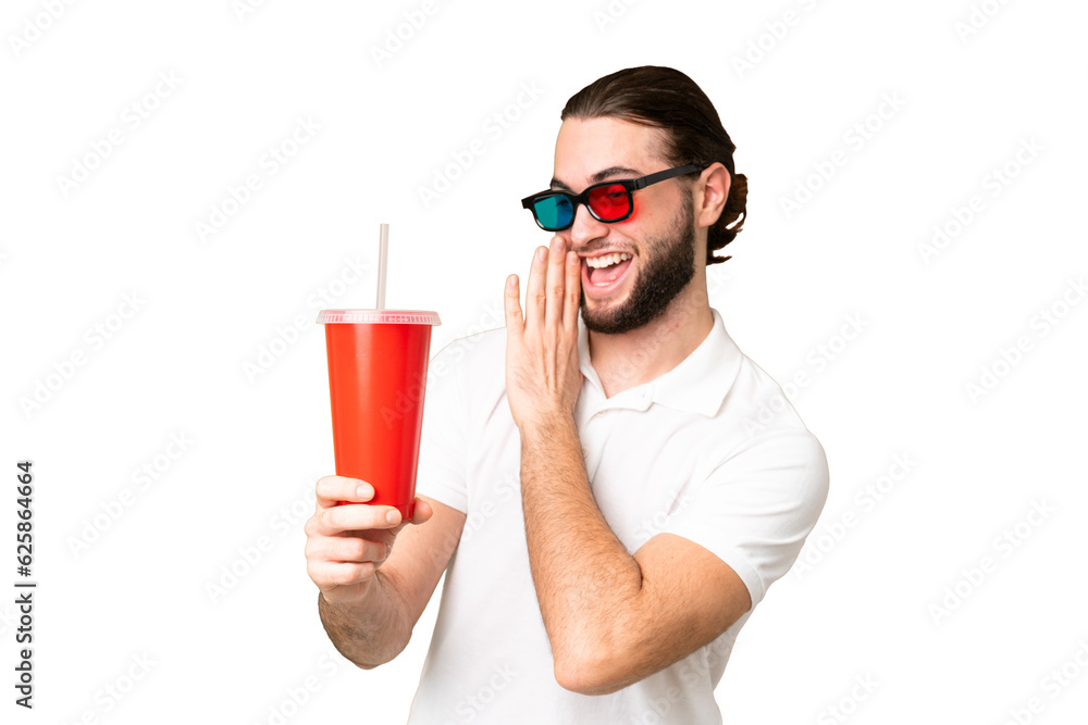 Young handsome man holding soda while watching a 3D movie over isolated chroma key background with surprise and shocked facial expression Young handsome man holding soda while watching a 3D movie over isolated chroma key background with surprise and shocked facial expression