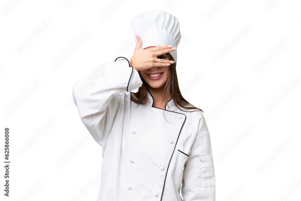 Young chef caucasian woman over isolated background covering eyes by hands and smiling Young chef caucasian woman over isolated background covering eyes by hands and smiling