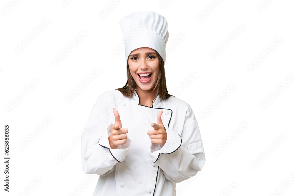 Young chef caucasian woman over isolated background pointing to the front and smiling Young chef caucasian woman over isolated background pointing to the front and smiling
