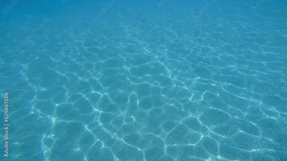 Underwater light refractions on the sea floor Underwater light refractions on the sea floor