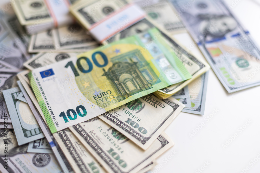 A lot of different money hryvnia euro and dollar bills on desk. exchange or saving concept. Paper banknotes A lot of different money hryvnia euro and dollar bills on desk. exchange or saving concept. Paper banknotes