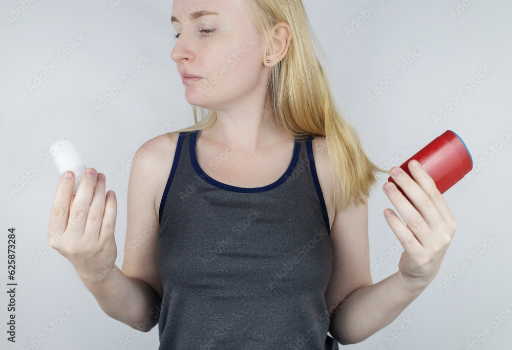 left or right. Girl chooses between eco-friendly deodorant without toxins and antiperspirant with toxic elements. In left hand Mineral alum crystal stick, in right hand classic remedy chemical nature left or right. Girl chooses between eco-friendly deodorant without toxins and antiperspirant with toxic elements. In left hand Mineral alum crystal stick, in right hand classic remedy chemical nature