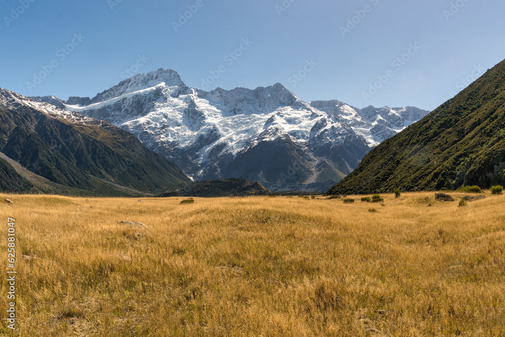 Fototapeta premium The dry Tasman valley near the Mt cook village with a backdrop of the snow covered Southern alps
