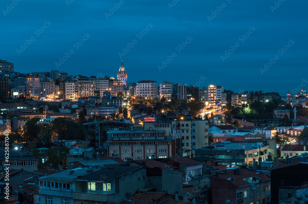 The Galata Tower on the Istanbul skyline at night, Turkey. City panorama at night