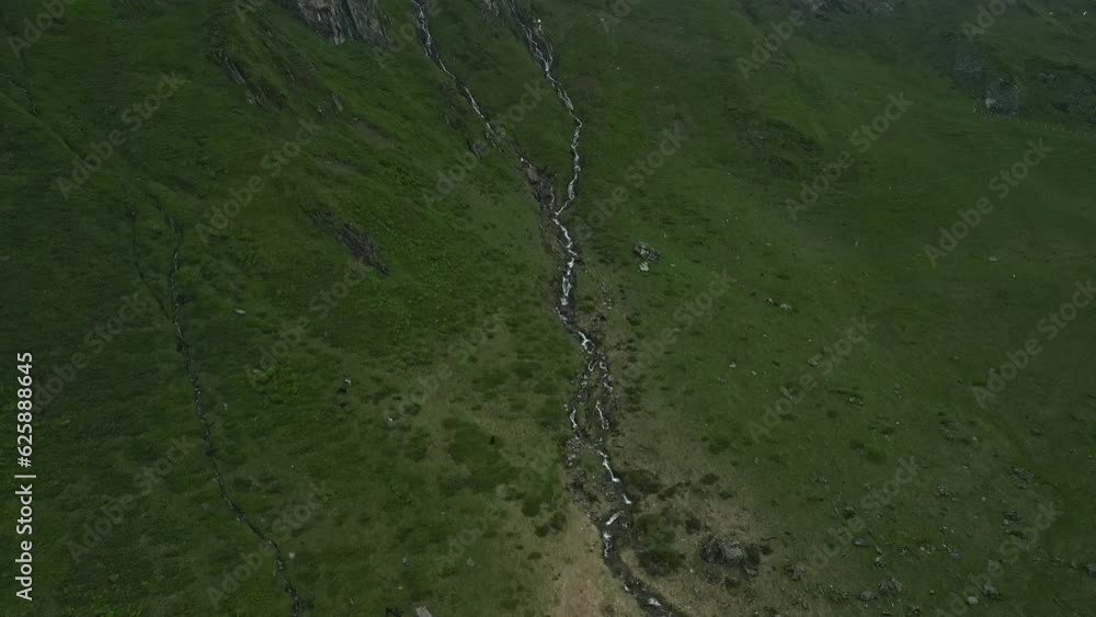 Follow the waterfall up into the clouds in green mountains Follow the waterfall up into the clouds in green mountains