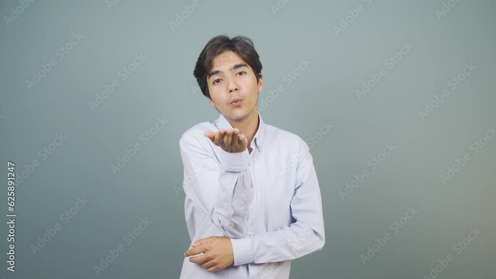 The man making cute gestures for the camera.