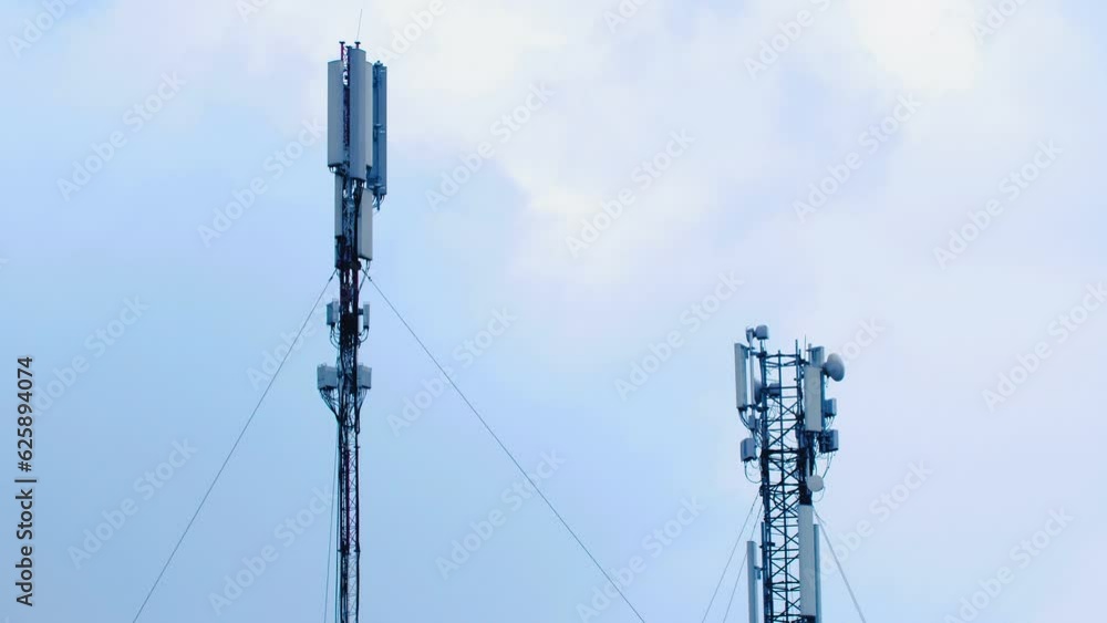 Cellular antennas on the background of a cloudy sky. Timelapse. Cellular Tower. Cumulus cloud cloudscape timelapse. Summer blue sky time lapse. Nature blue sky. White clouds. Cloud time lapse Cellular antennas on the background of a cloudy sky. Timelapse. Cellular Tower. Cumulus cloud cloudscape timelapse. Summer blue sky time lapse. Nature blue sky. White clouds. Cloud time lapse
