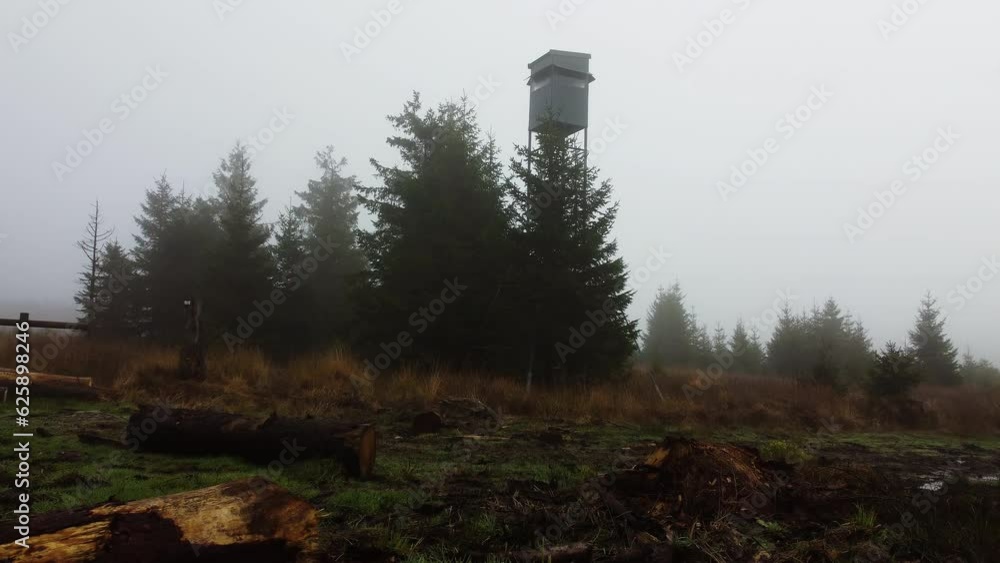 A drone flies toward an observation tower shrouded in mist in Belgium A drone flies toward an observation tower shrouded in mist in Belgium