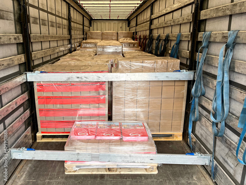 Transportation of cardboard and wooden cargo in a semi-trailer truck
