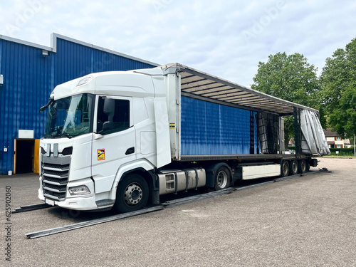 An open semi-trailer curtain on both sides for loading the goods