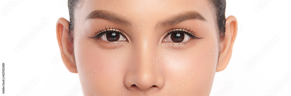 Fototapeta premium Close-up shot of beautiful Asian woman's eyes on white background.