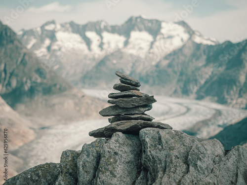 Stones stacked and balanced on a mountain ridge © neil