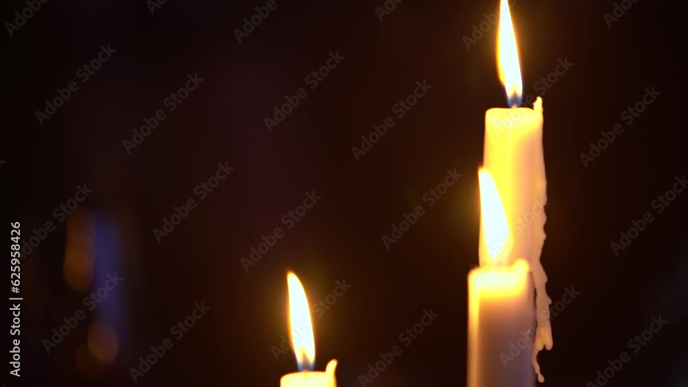 Candles on the holiday table. Slow motion Candles on the holiday table. Slow motion