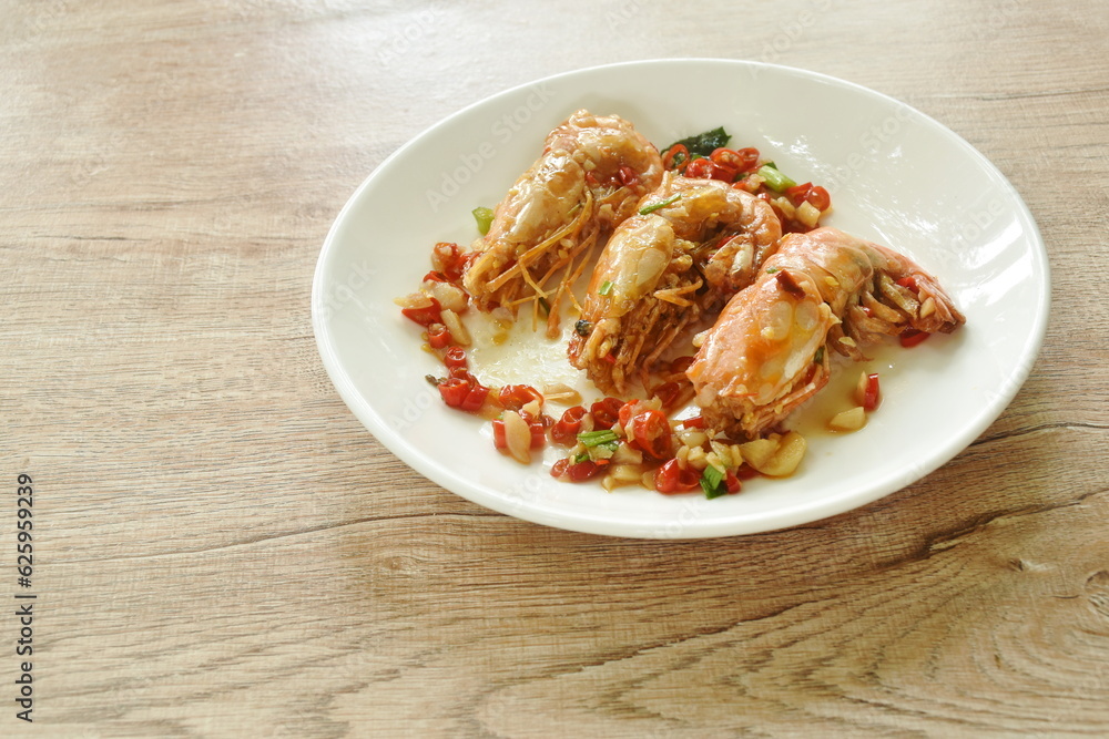 fried river shrimp with salt and chili sauce on plate fried river shrimp with salt and chili sauce on plate