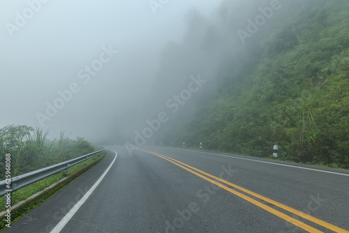 Beautiful asphalt road in the foggy.