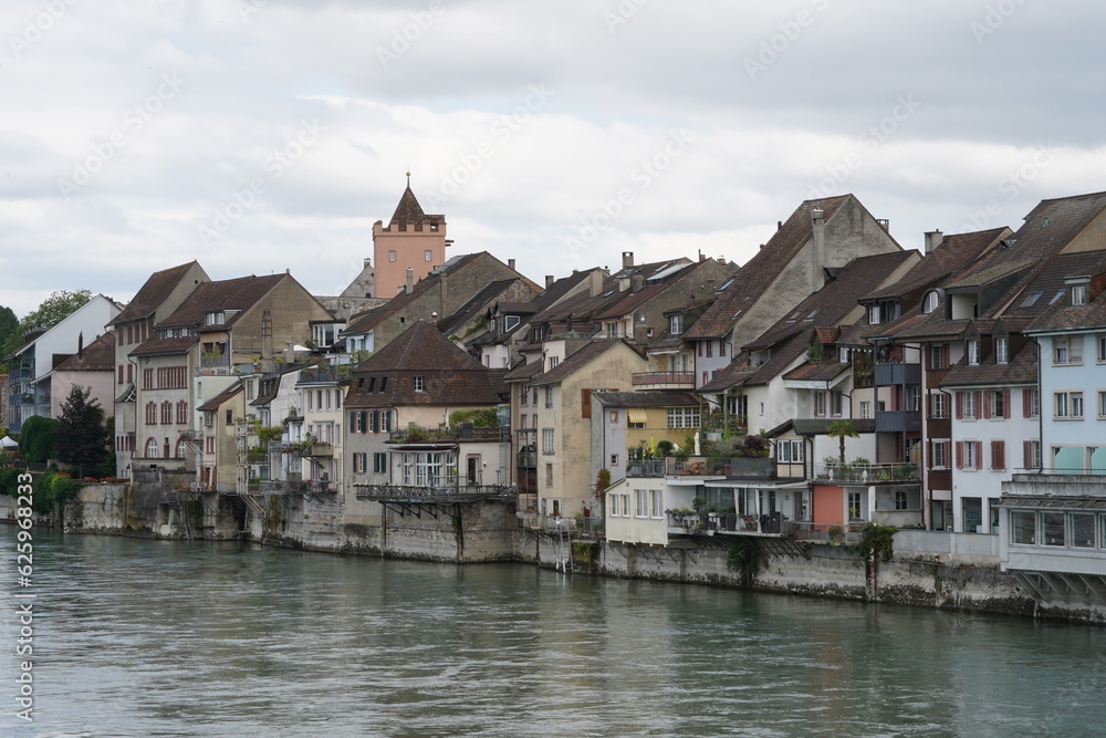 Historical old city of Rheinfelden in Switzerland along the Rhine river. The houses are built close to one another and are used for residential purposes. The silhouette is typical for the town. Historical old city of Rheinfelden in Switzerland along the Rhine river. The houses are built close to one another and are used for residential purposes. The silhouette is typical for the town.