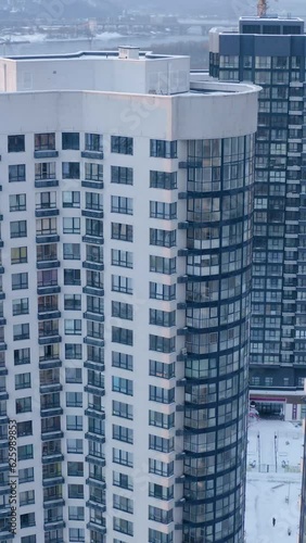 Wallpaper Mural Drone view of modern office building with transparent glass windows and skyscrapers reflection in winter.  Torontodigital.ca