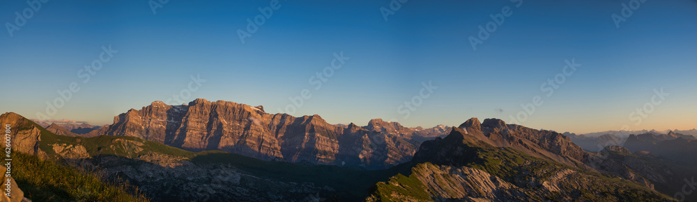 large panorama of glarus mountains at sunset