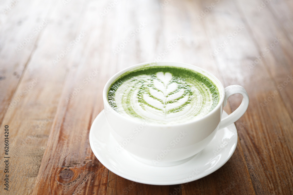 Green tea with on brown wooden table surface Green tea with on brown wooden table surface