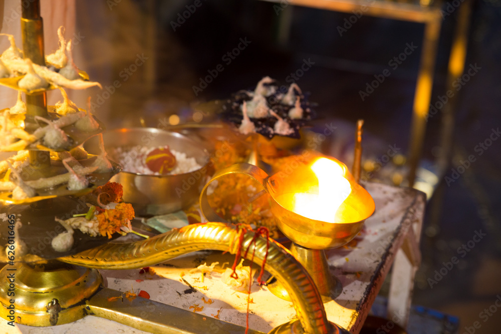 Blur oil diya lamps with flaming fire for ganga aarti 