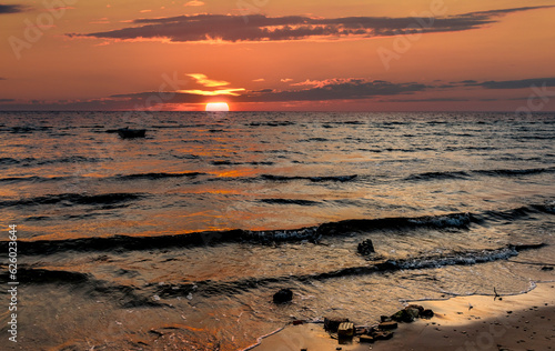 Coastal landscape with sunset over the horizon of the Baltic Sea