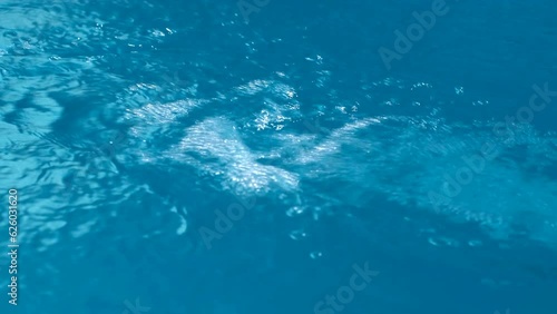 Wallpaper Mural A jet of blue water flows with a strong pressure into the reservoir. Torontodigital.ca