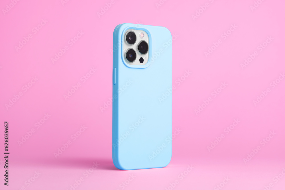 iPhone 15 Pro in blue case back side view isolated on pink background, phone case mock up iPhone 15 Pro in blue case back side view isolated on pink background, phone case mock up