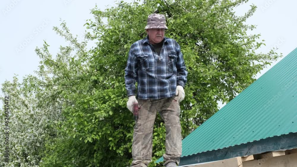 elderly man in plaid shirt as he fearlessly builds his own home from ground up. fearlessly standing on roof, it symbolizes pursuit of dreams and triumph of self-reliance. Self-Built Home elderly man in plaid shirt as he fearlessly builds his own home from ground up. fearlessly standing on roof, it symbolizes pursuit of dreams and triumph of self-reliance. Self-Built Home
