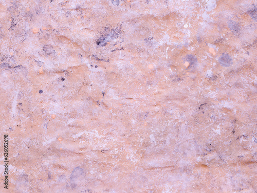 Grunge painted surface of wall. Pink urban cement wall, stucco. Grunge architecture backdrop. Uneven solid surface. Drawing texture.