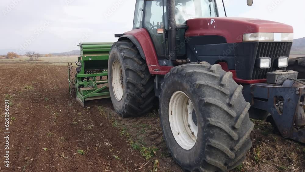 Farmer with tractor seeding in slow motion, slow motion Farmer with tractor seeding in slow motion, slow motion
