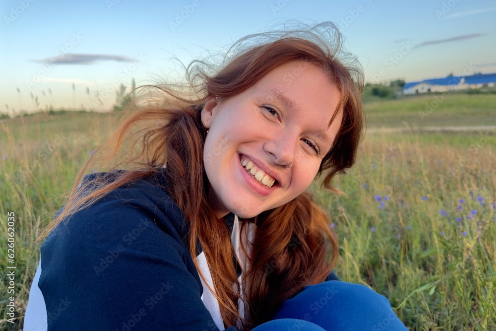 happy girl in the field in summer at sunrise or sunset, enjoying nature happy girl in the field in summer at sunrise or sunset, enjoying nature