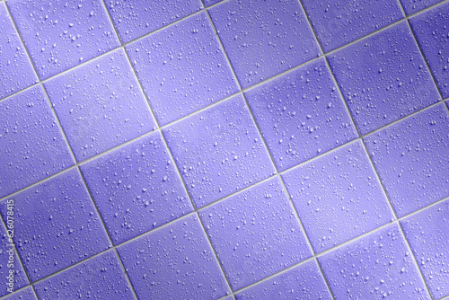 angled bath tiles background with bright joints and water droplets, wet tiled colorful background with angular highlight