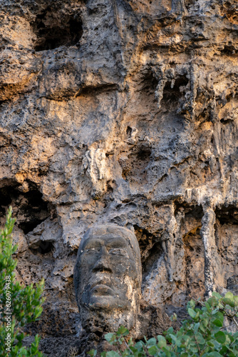 Mans face carved on the rocks of a local beach in Puerto Rico called Puente Hermina