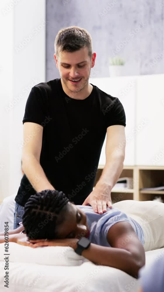 Male Instructor Teaching Massage Technique To Group Male Instructor Teaching Massage Technique To Group