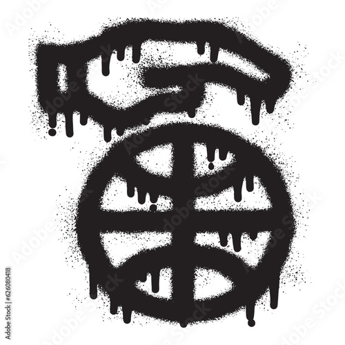 Hand dribbling a basketball with black spray paint