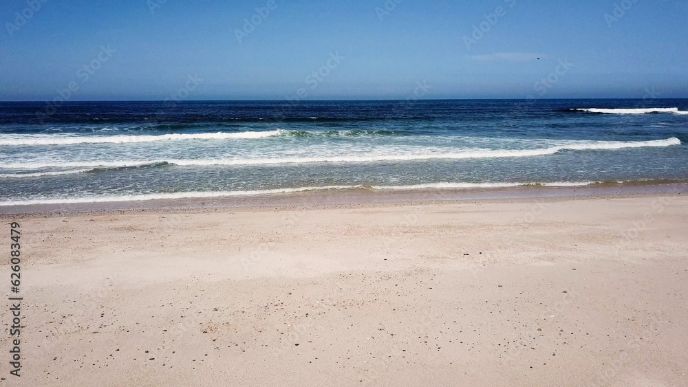 Ocean waves crashing on beach