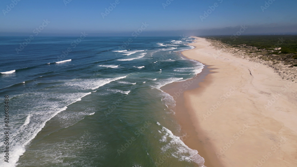 Side view of waves crashing on sandy beach Side view of waves crashing on sandy beach
