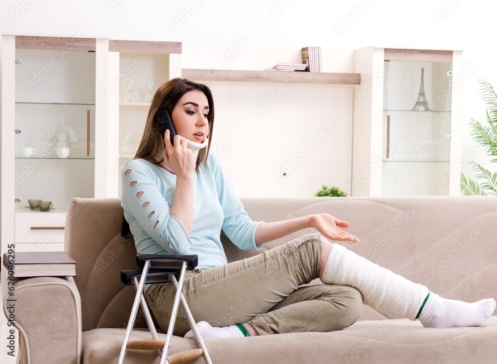 Young woman after car accident suffering at home Young woman after car accident suffering at home
