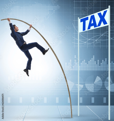 Obraz na plátně Businessman jumping over tax in tax evasion avoidance concept