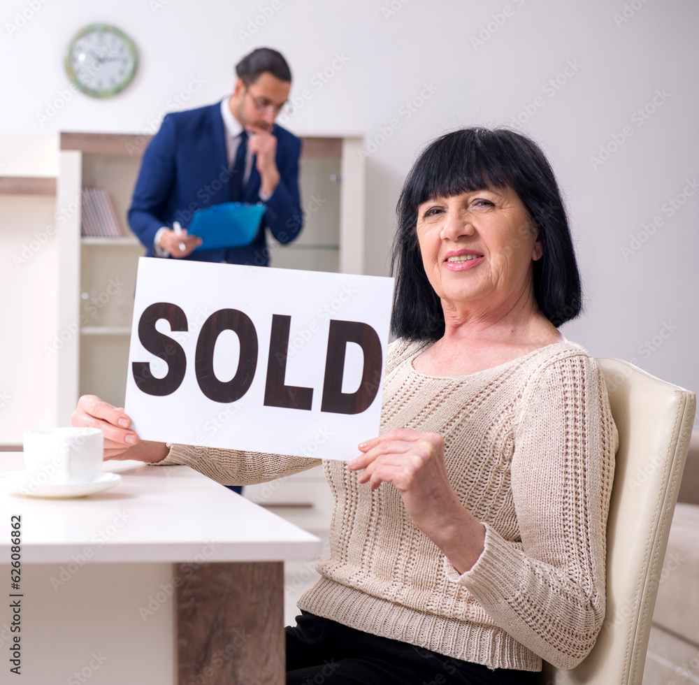 Male real estate agent and female client in the apartment Male real estate agent and female client in the apartment