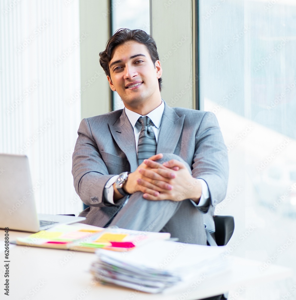 Young successful businessman working at the office Young successful businessman working at the office