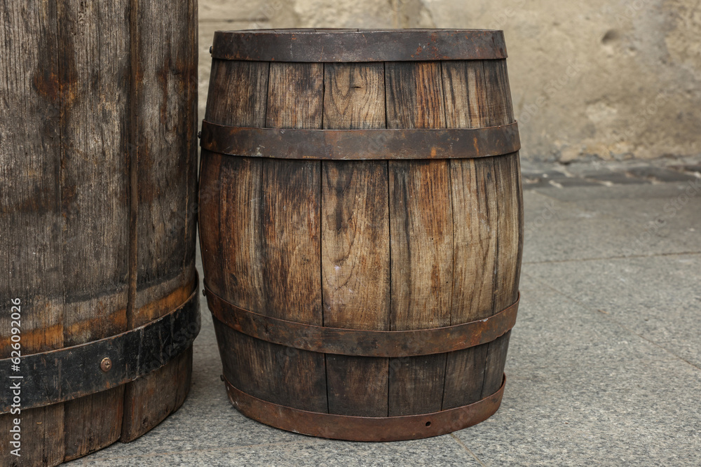 Traditional wooden barrels on street outdoors. Wine making