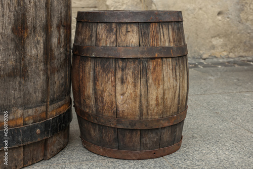 Traditional wooden barrels on street outdoors. Wine making